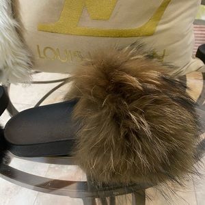 Beautiful fur sandals with oversized fur to cover feet fully. Like New!